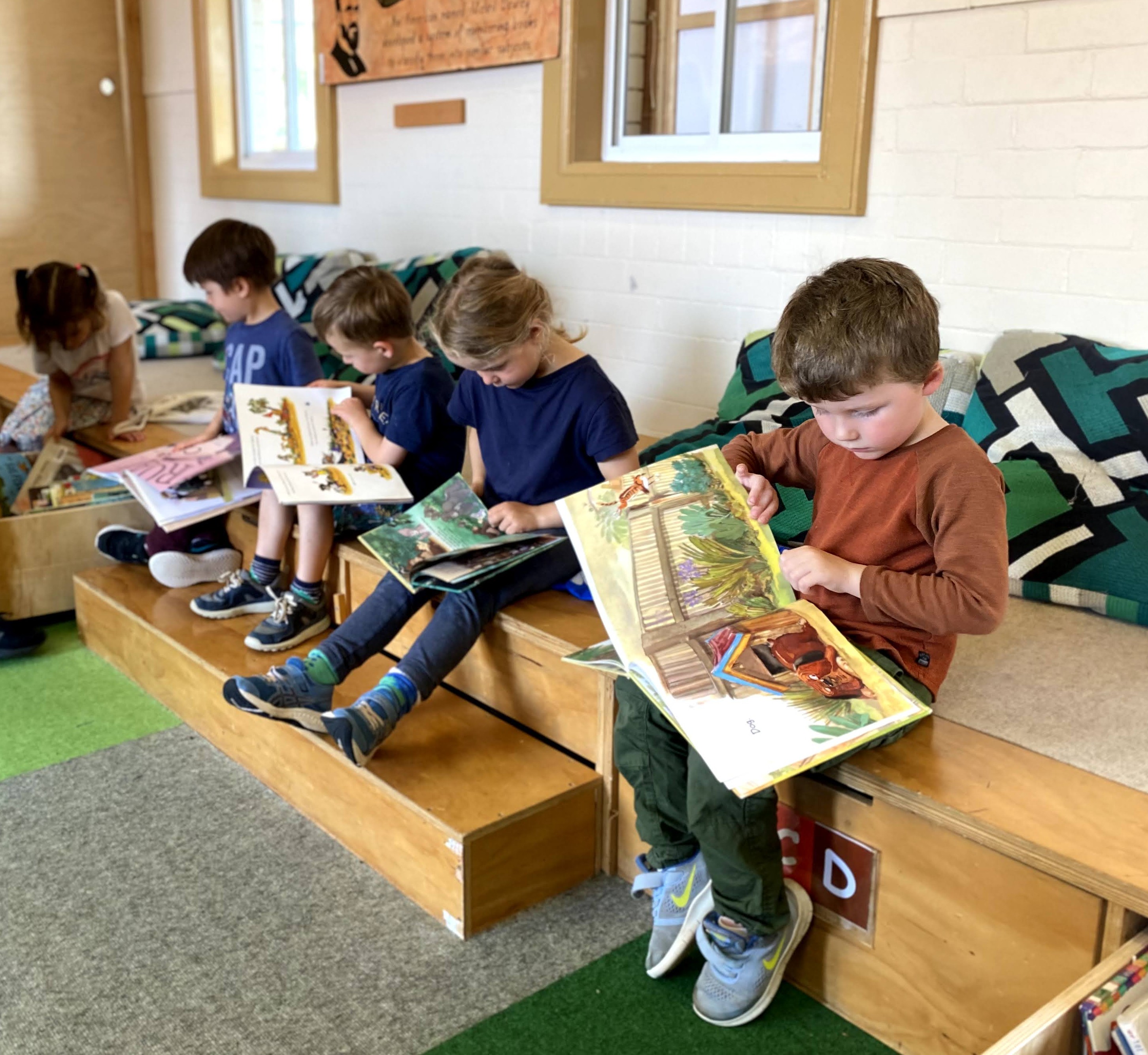 Children reading in the Montessori East Library