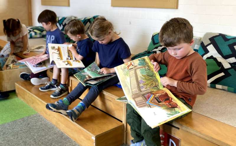 Children reading in the Montessori East Library